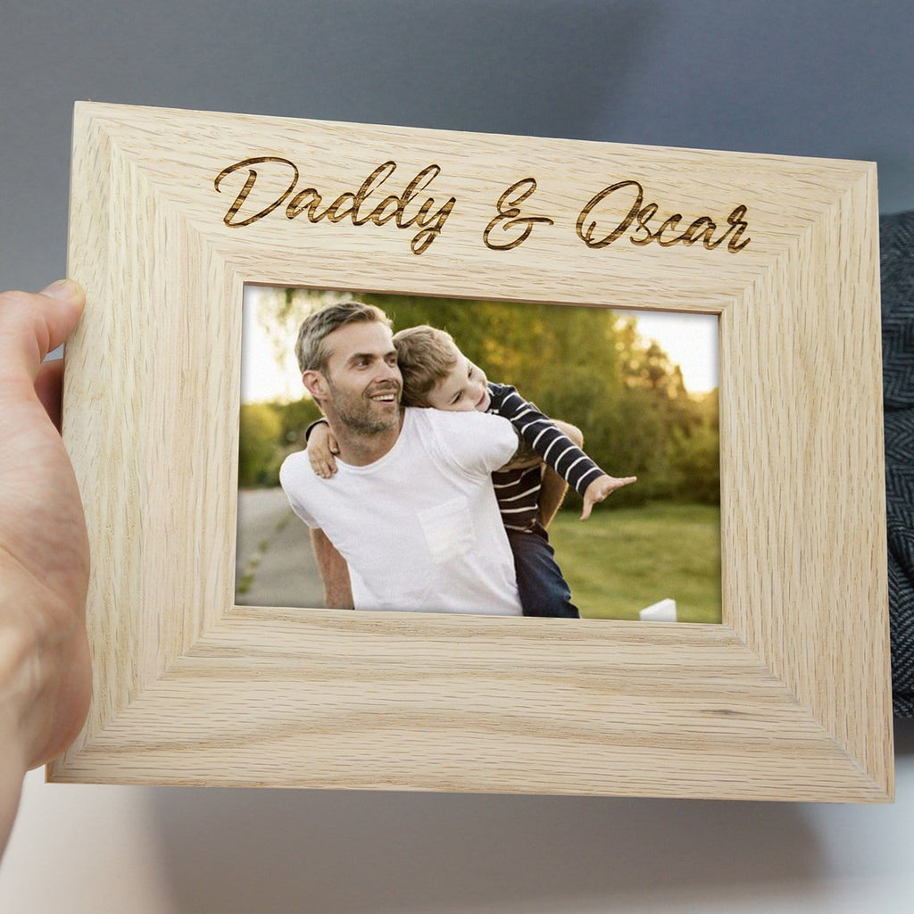 Solid oak frame with personalised engraving that reads 'daddy and oscar' by Original Monkey Gifts.