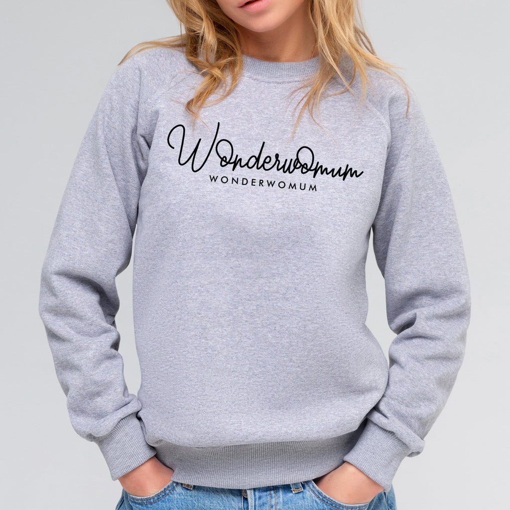 Woman wearing grey raglan sleeved sweater with personalised text reading Wonderwomum in black, paired with blue denim jeans. By Original Monkey Gifts.