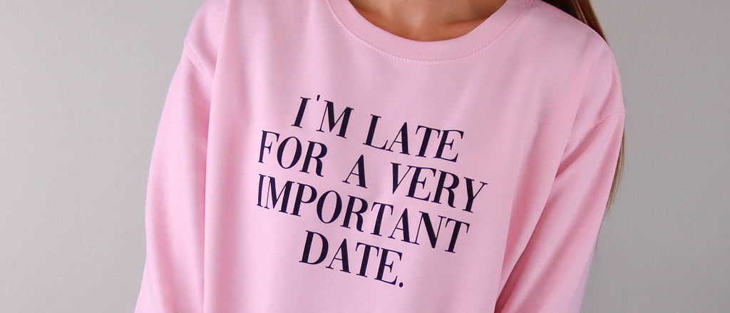 Personalised Pink Sweater with a slogan on the front saying ' I'm late for a very important date' created by the online personalised gift store Original Monkey