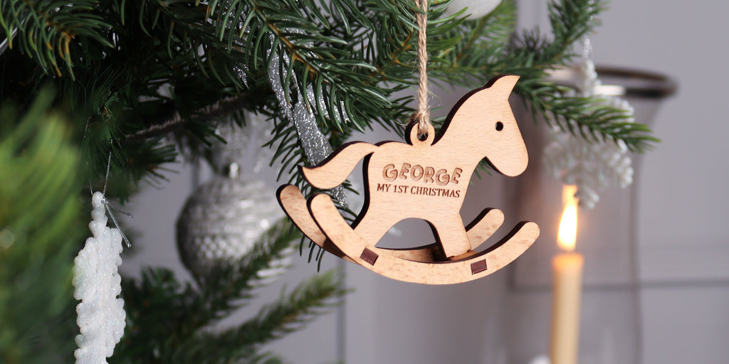 a 3d rocking horse christmas decoration made out of birch mdf, it is engraved with child's name