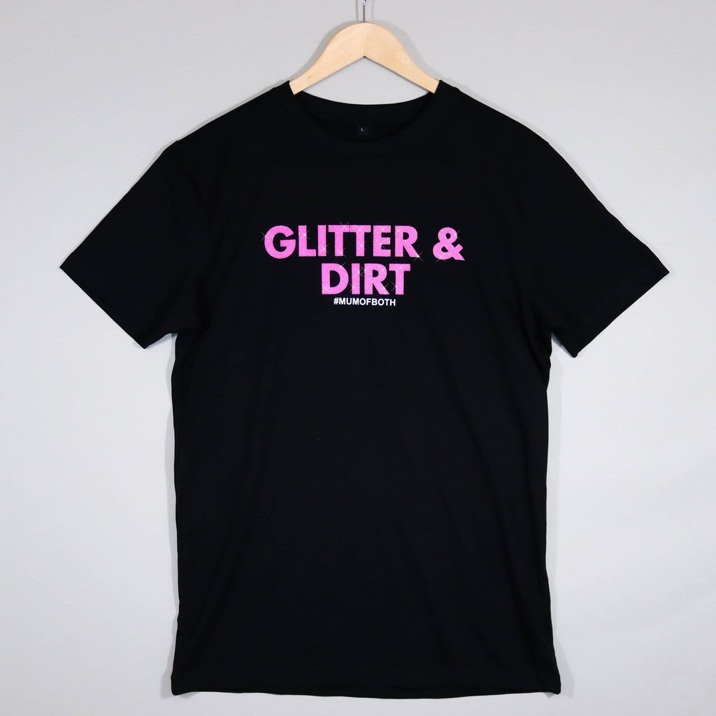 Black T shirt hanging on a white hanger with pink glittery text reading 'glitter and dirt #mum of both' by Original Monkey Gifts.