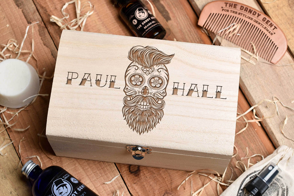 Wooden box on a wooden table top with engraved sugar skull and personalised engraving by Original Monkey Gifts.