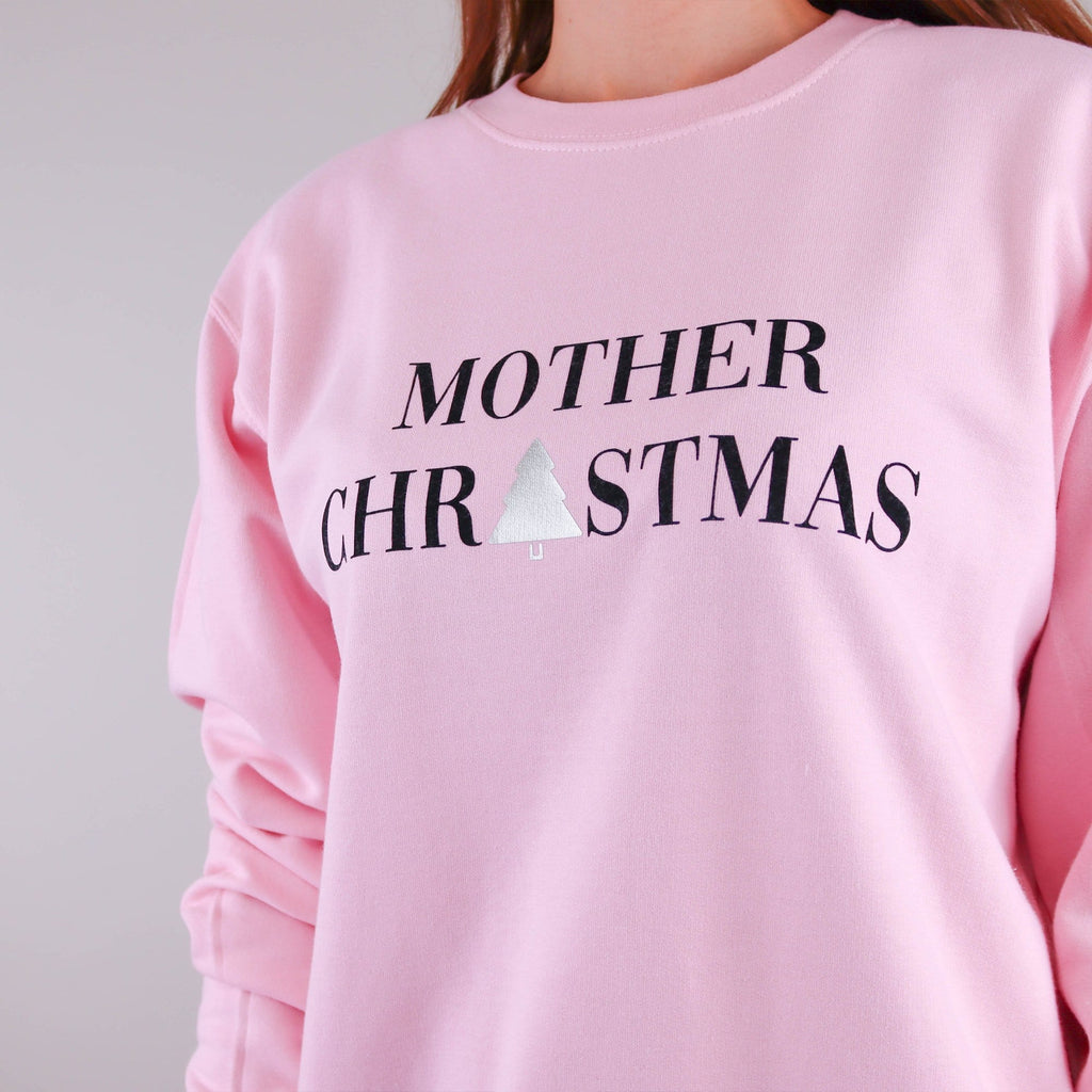 Woman wearing a pink jumper with text reading 'Mother Christmas' by Original Monkey Gifts.
