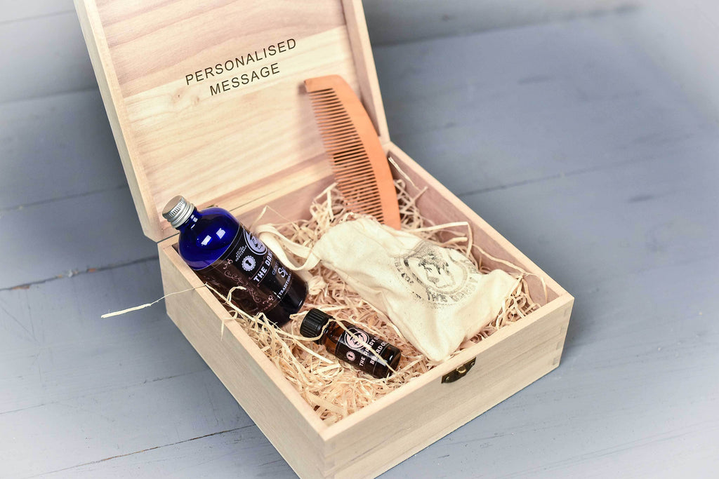 Open wooden box with beard grooming set and personalised message inside by Original Monkey Gifts.