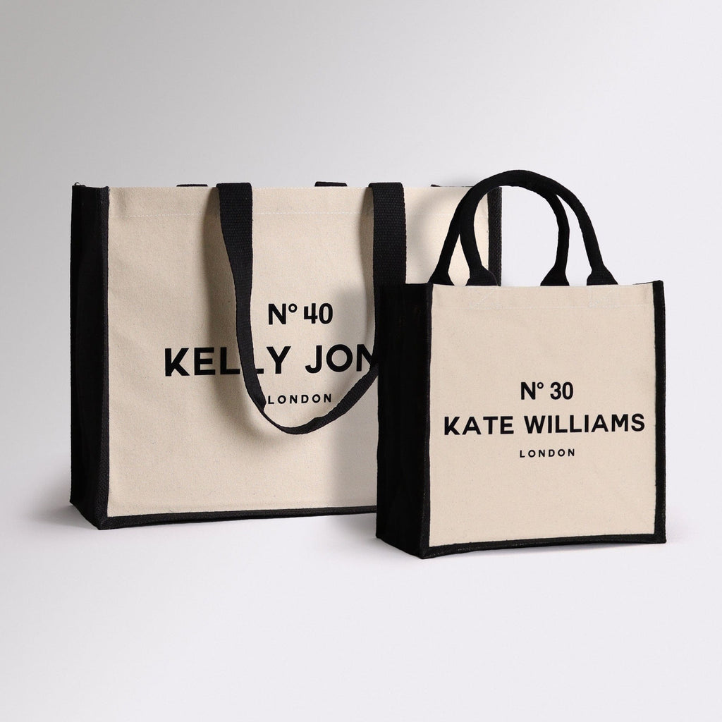 two different style tote bags that are personalised on the front with the recients details, designed to look like the front of perfum bottle