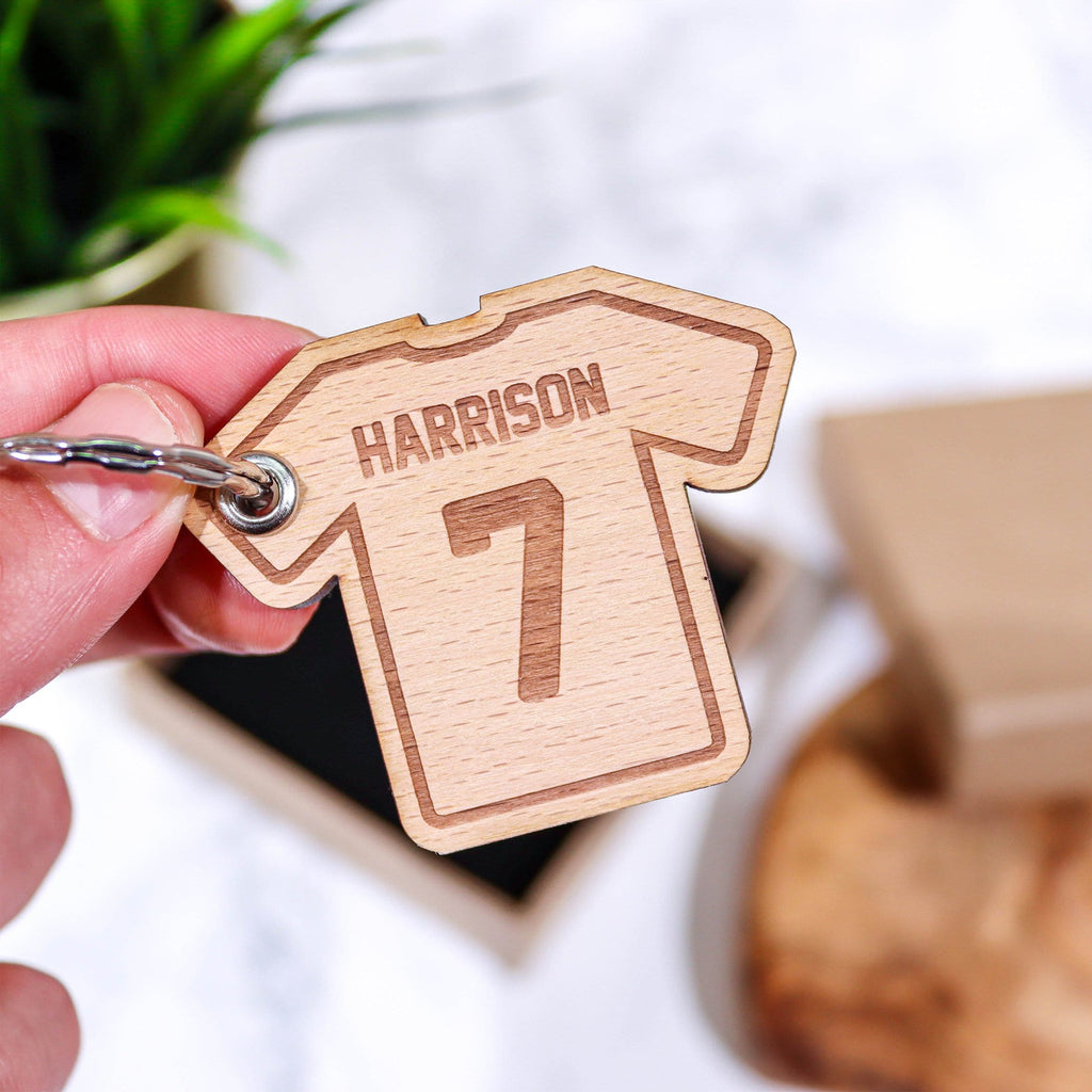 T shirt shaped wooden keyring with personalised name and number by Original Monkey Gifts.