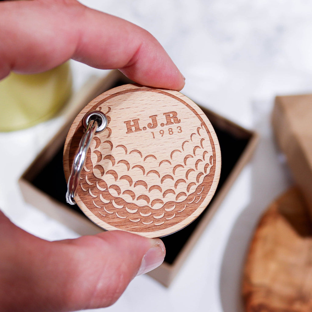 Circular wooden keyring with gold ball design and initials engraved on top by Original Monkey Gifts.