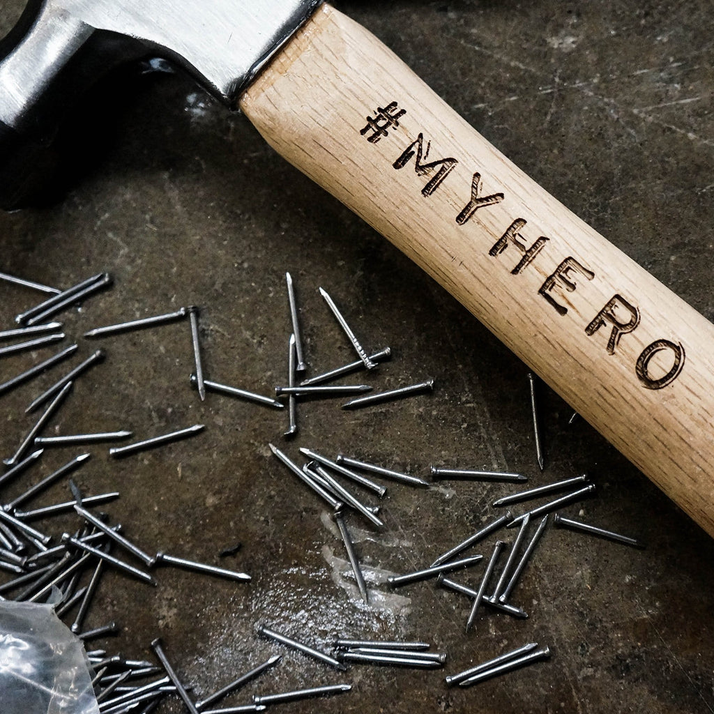 Wooden hammer with personalised engraving that reads 'my hero' by Original Monkey Gifts.