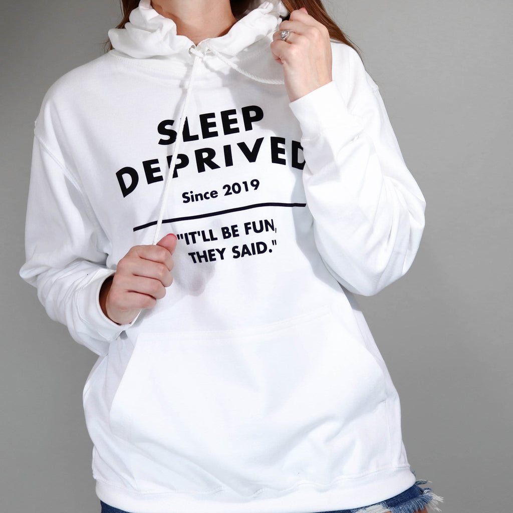 Woman wearing white hoodie with sleep deprived written in black with personalisation. By Original Monkey Gifts