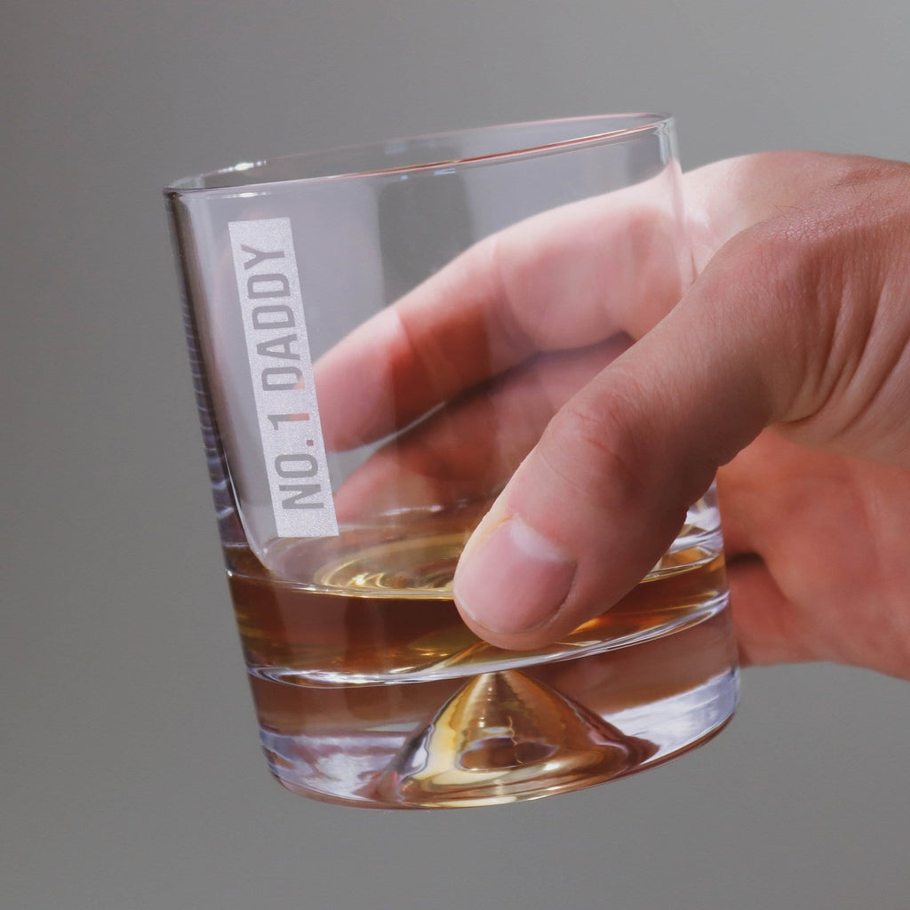 Man's hand holding a tumbler glass with personalised message that reads 'No1 Daddy' by Original Monkey Gifts.