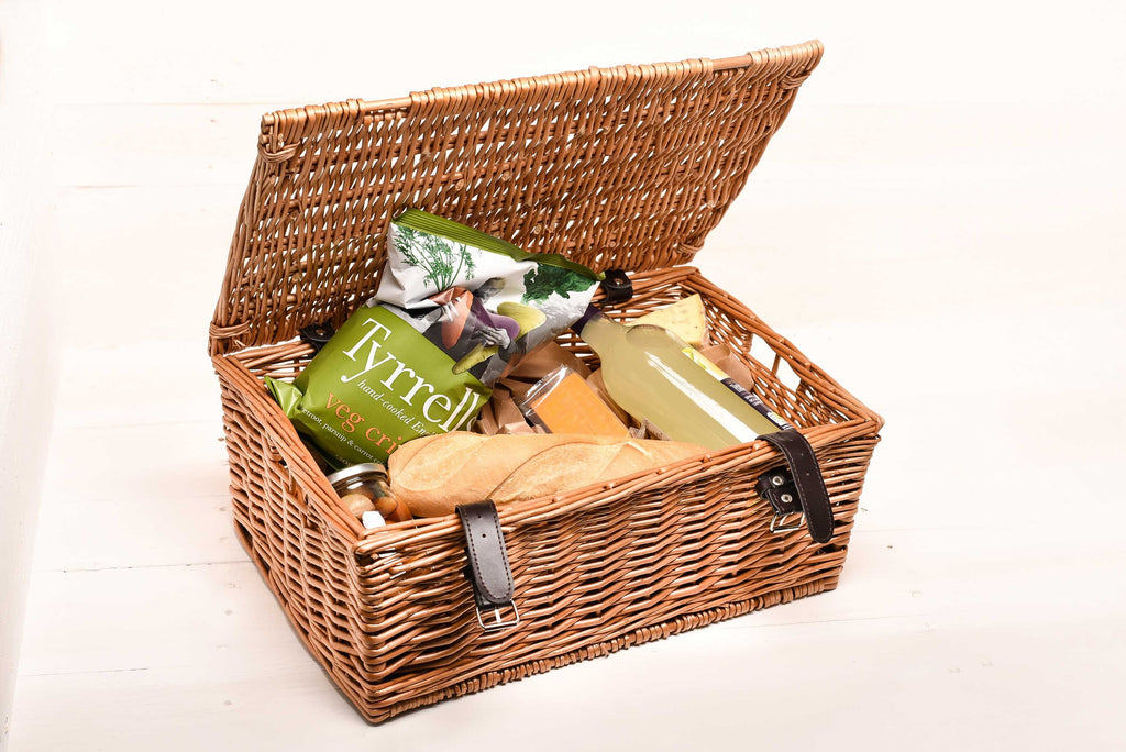 A personalised willow hamper with the initials 'j and k' engraved on top by Original Monkey Gifts. Food is displayed inside the basket.