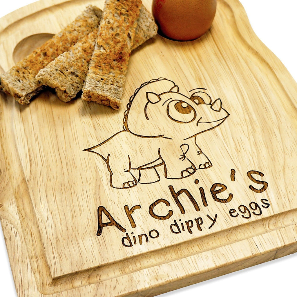 Wooden egg breakfast board with personalised engraving and dinosaur engraving by Original Monkey Gifts.