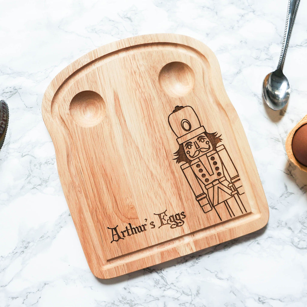 Egg breakfast board with personalised engraving and nutcracker figure by Original Monkey Gifts.