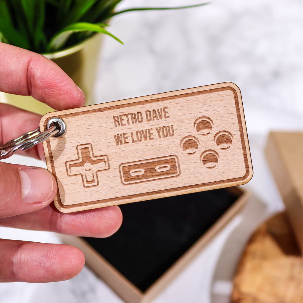 Wooden keyring with a games controller engraved and personalised message by Original Monkey Gifts.
