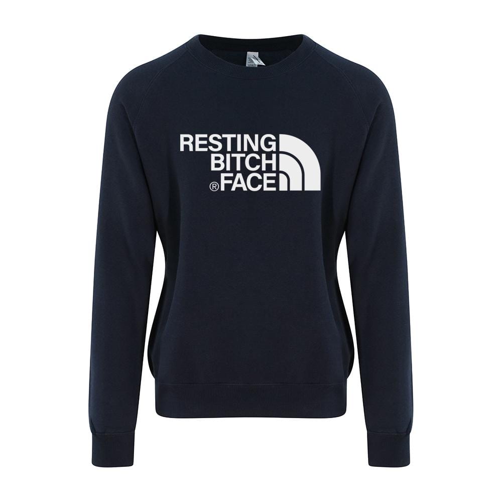Woman wearing navy sweater with resting bitch face written in white across the front. By Original Monkey Gifts